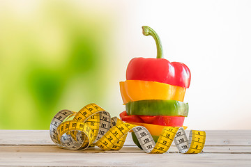 Image showing Colorful pepper in a pile on a wooden table