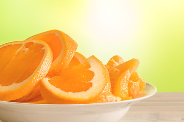 Image showing Oranges on a white plate