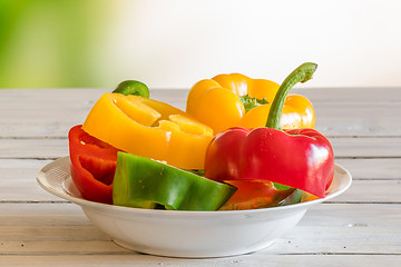 Image showing Pepper dish on a wooden table