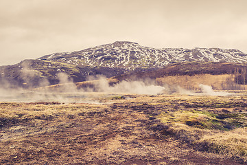 Image showing Misty landscape in front of a mountain