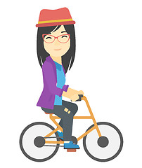 Image showing Woman cycling to work.