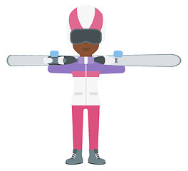 Image showing Woman holding skis.