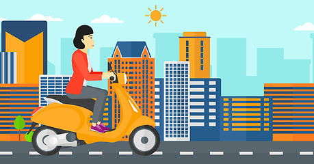 Image showing Woman riding scooter.