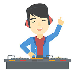 Image showing Smiling DJ with console.
