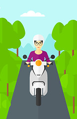 Image showing Woman riding scooter.