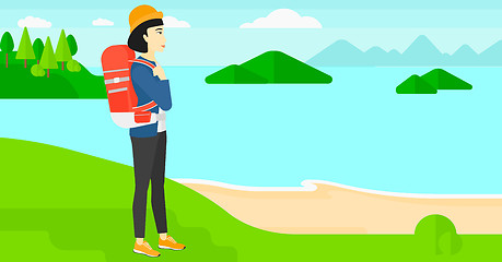 Image showing Woman with backpack hiking.