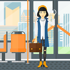 Image showing Woman standing inside public transport.