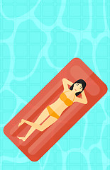 Image showing Woman relaxing in swimming pool.