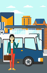 Image showing Woman standing near bus.