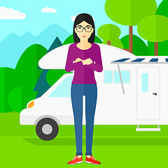 Image showing Woman standing in front of motor home.