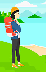 Image showing Woman with backpack hiking.