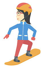 Image showing Young woman snowboarding.