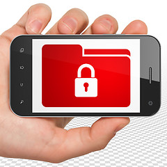 Image showing Finance concept: Hand Holding Smartphone with Folder With Lock on display