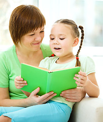 Image showing Mother is reading book with her daughter