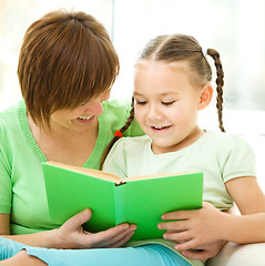 Image showing Mother is reading book with her daughter