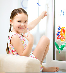 Image showing Portrait of a cute girl playing with paints