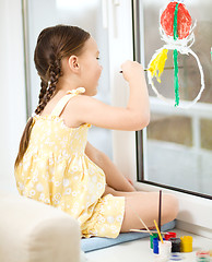 Image showing Portrait of a cute girl playing with paints