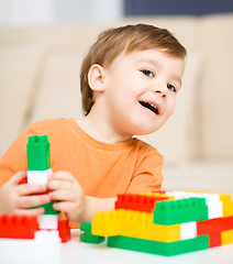 Image showing Boy is playing with building blocks