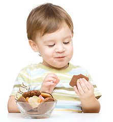 Image showing Portrait of a boy with cookies