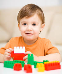 Image showing Boy is playing with building blocks