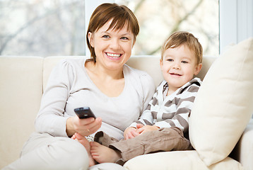 Image showing Mother and her son are watching tv show