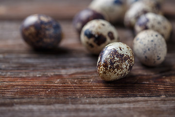 Image showing Group of quail eggs on thewooden background