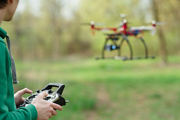 Image showing Man controling a drone.