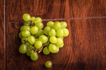 Image showing Green grapes on a dark table