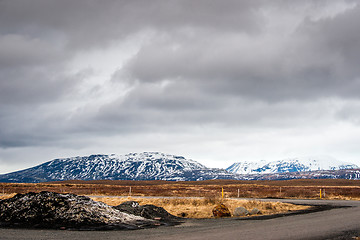 Image showing Cloudy weather by a road