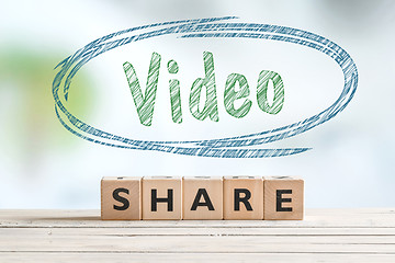 Image showing Share video sign on a table
