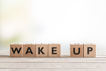 Image showing Wake up sign with wooden cubes