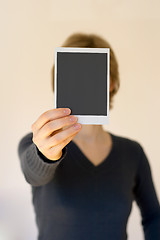 Image showing woman holding empty card in front