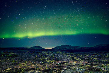 Image showing Aurora Borealis over distant mountains