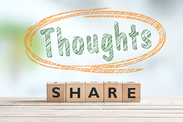 Image showing Share your thoughts sign on a desk