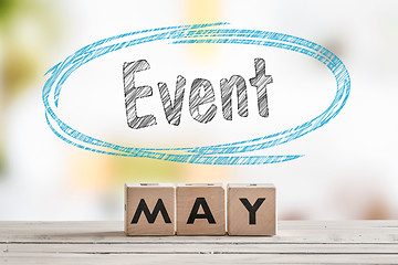 Image showing May event sign on a wooden table