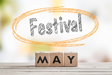 Image showing May festival sign on a wooden table