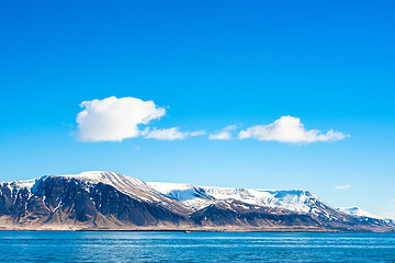 Image showing Skies over a mountain in the ocean