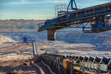 Image showing Long conveyor belt transporting ore