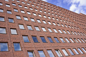 Image showing Front of a Brick building and a nice blue sky