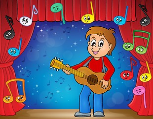 Image showing Boy guitar player on stage theme 2