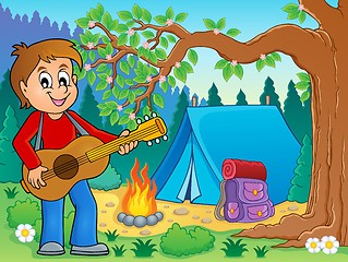 Image showing Boy guitar player in campsite theme 2