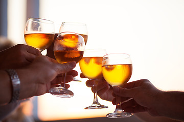 Image showing Group of people toasting with white wine