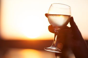 Image showing Close-up of hand holding glass of drink