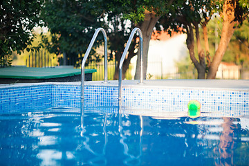 Image showing Outdoor swimming pool with tiled blue walls