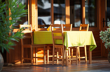 Image showing Colorful outdoor table at an open-air restaurant