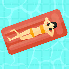 Image showing Woman relaxing in swimming pool.