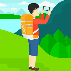 Image showing Backpacker taking photo.