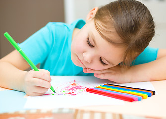 Image showing Cute cheerful child drawing using felt-tip pen