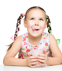 Image showing Cute little girl with a glass of milk