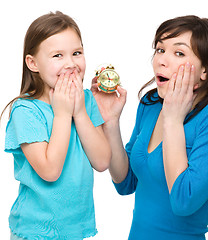 Image showing Little girl and her mother are anxious about time